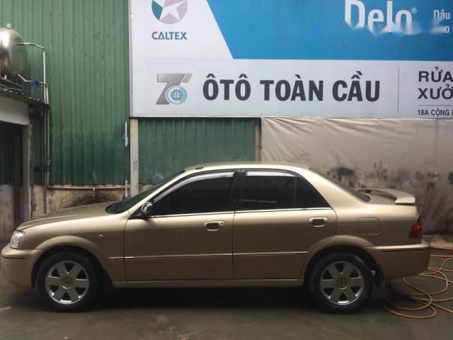 Tôi bán Ford Laser đời 2002, màu vàng số sàn, giá chỉ 232 triệu