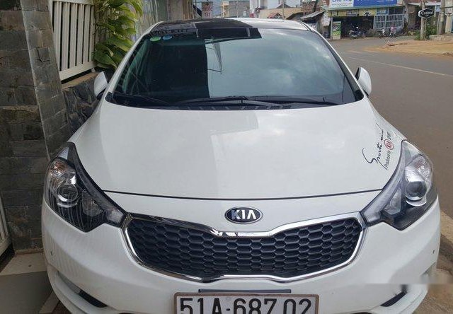 Cần bán xe Kia K3 sản xuất 2013, màu trắng đã đi 26000 km, giá tốt