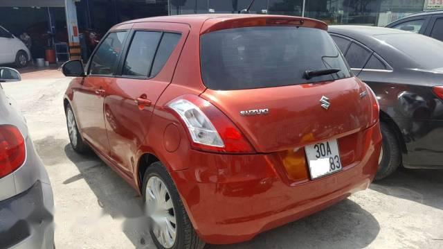 Gia đình không còn nhu cầu sử dụng nên bán xe Suzuki Swift 2014, màu đỏ cam, số tự động, đăng ký tháng 10/2014