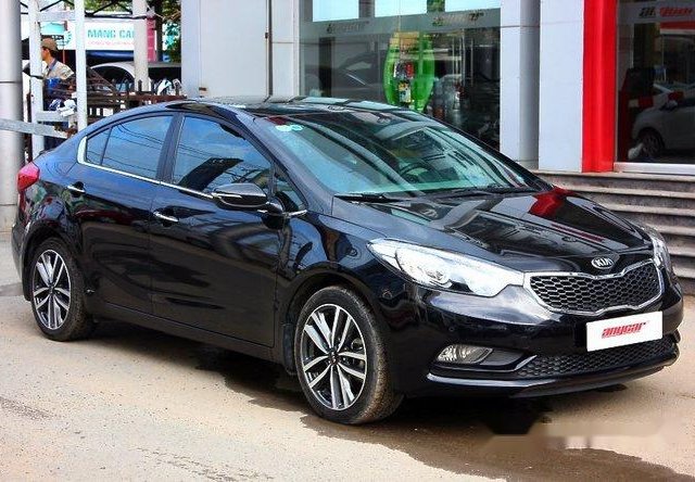 Cần bán gấp Kia K3 1.6AT đời 2016, màu đen, giá chỉ 592 triệu