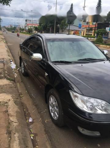 Bán Toyota Camry đời 2004, màu đen, 409 triệu