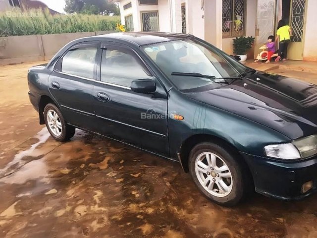 Cần bán lại xe Mazda 323 đời 2000, màu xanh lục chính chủ