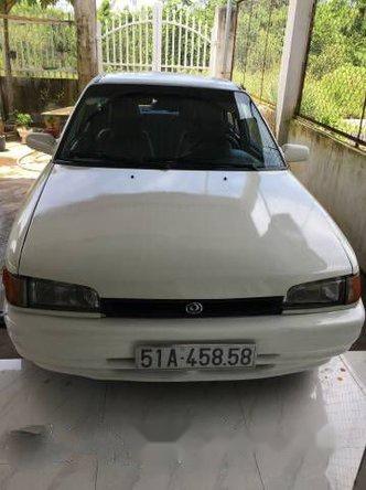 Cần bán Mazda 323 đời 2003, màu trắng đã đi 140000 km