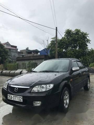 Cần bán Mazda 323 đời 2002, màu đen