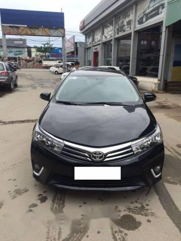 Cần bán gấp Toyota Corolla Altis G 1.8MT đời 2016, màu đen số sàn, giá 632tr