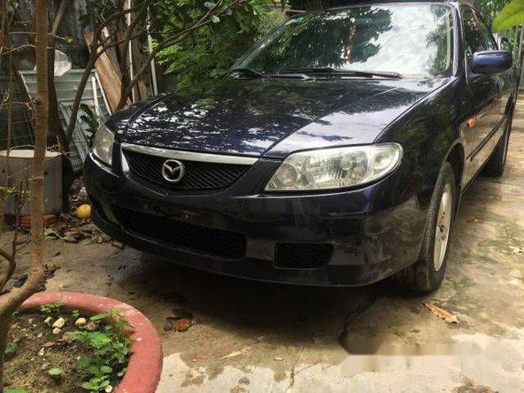 Cần bán gấp Mazda 323 đời 2003, màu đen, đã đi 90000 km