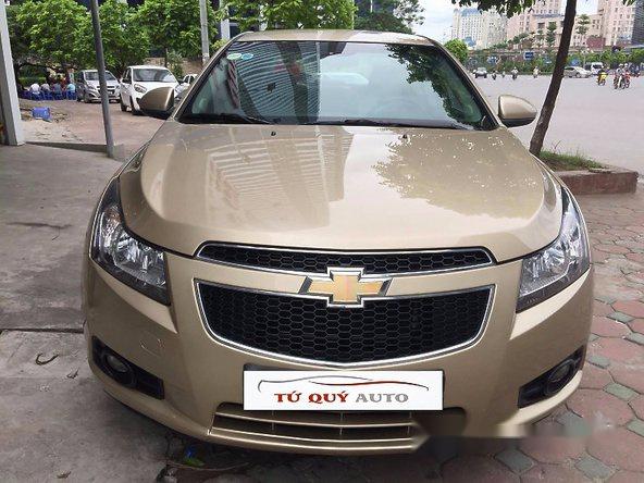 Bán ô tô Chevrolet Cruze LS 1.6MT đời 2013, màu vàng đã đi 39000 km