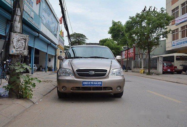 Cần bán Kia Carnival AT đời 2009, màu nâu số tự động, 289 triệu