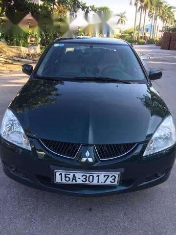 Cần bán gấp Mitsubishi Lancer đời 2004, màu đen số tự động, 199 triệu