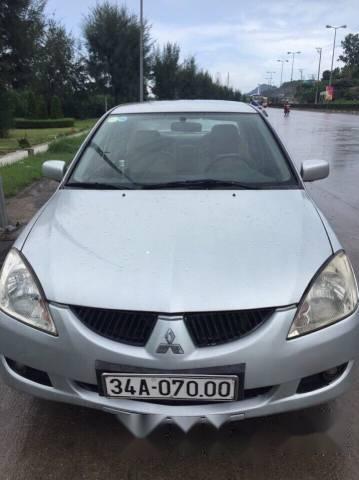 Gia đình bán xe Mitsubishi Lancer đời 2003, màu bạc