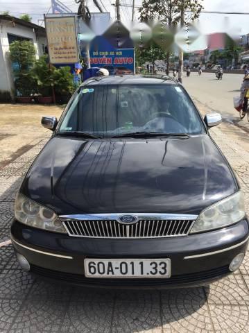 Cần bán gấp Ford Laser 1.8 đời 2003, màu đen xe gia đình