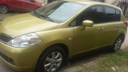 Bán Nissan Tiida 1.8l AT 2007, màu vàng, nhập khẩu  