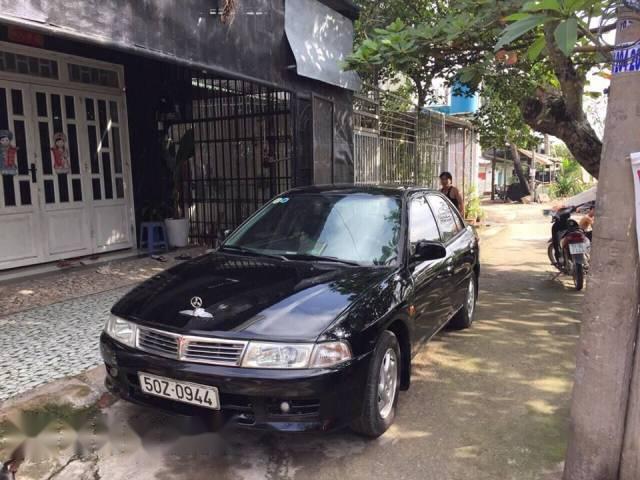 Bán xe Mitsubishi Lancer năm 2000, màu đen còn mới, giá chỉ 129 triệu