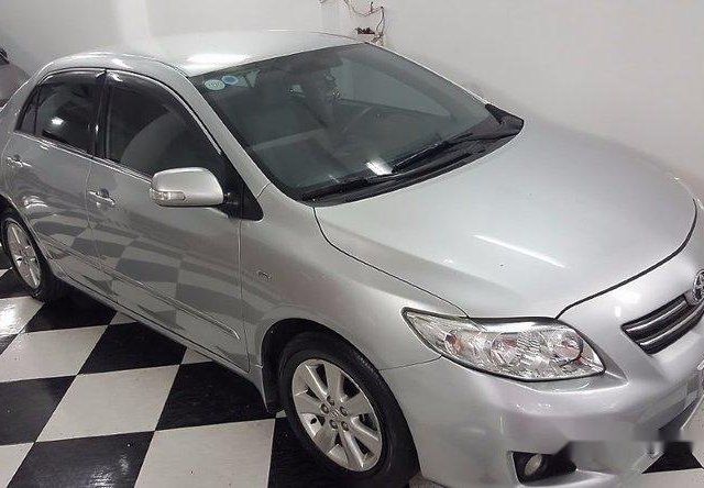 Bán xe Toyota Corolla altis 1.8G đời 2010, màu bạc 