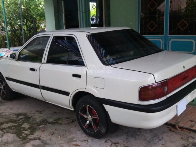 Cần bán gấp Mazda 323 đời 1995, màu trắng, nhập khẩu ít sử dụng, giá tốt