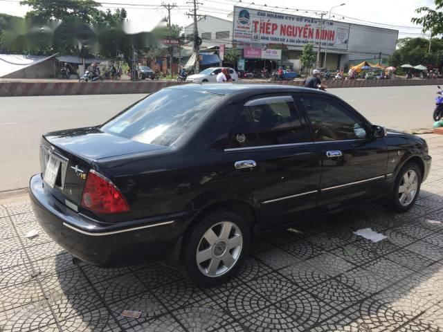 Bán ô tô Ford Laser Ghia 1.8 đời 2003, màu đen 