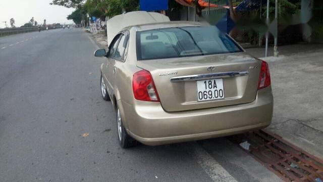 Cần bán xe Daewoo Lacetti đời 2004, màu ghi vàng  