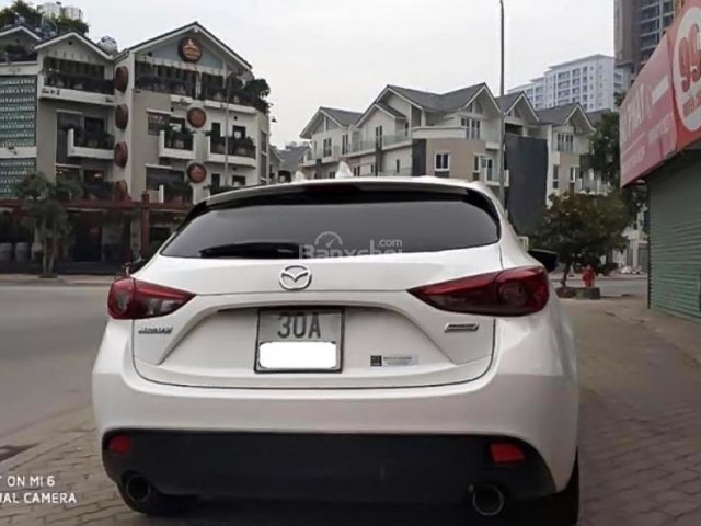 Cần bán Mazda 3 1.5 AT đời 2015, màu trắng, nhập khẩu nguyên chiếc số tự động