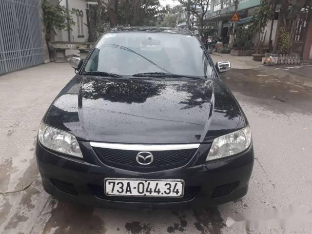 Bán xe Mazda 323 đời 2002, màu đen chính chủ, 165tr