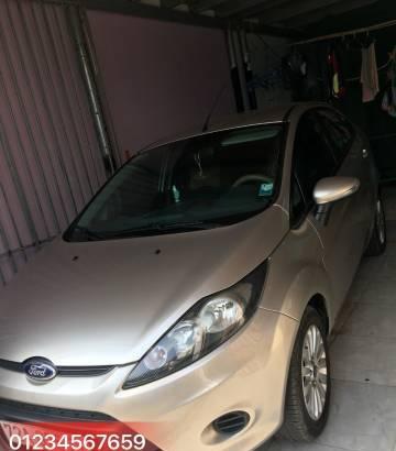 Gia đình bán Ford Fiesta đời 2011, màu vàng cát