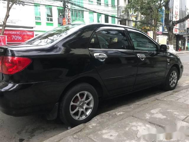 Cần bán lại xe Toyota Corolla sản xuất 2003, màu đen