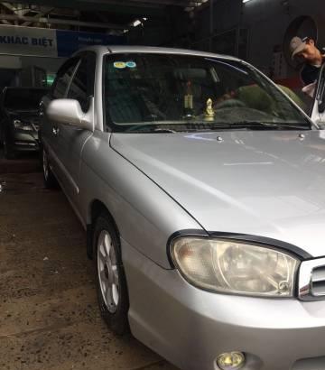 Bán xe Kia Spectra đời 2004, màu bạc, 135 triệu