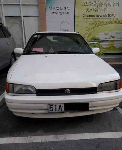 Cần bán gấp Mazda 323 đời 1998, màu trắng, 90 triệu