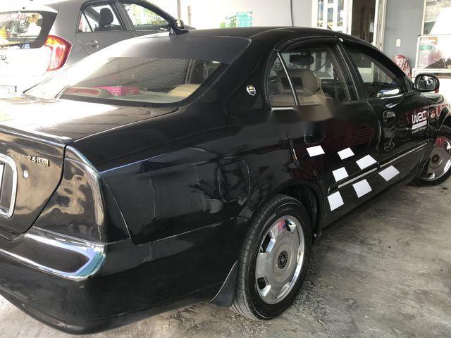 Cần bán gấp Daewoo Magnus đời 2004, màu đen chính chủ, giá tốt