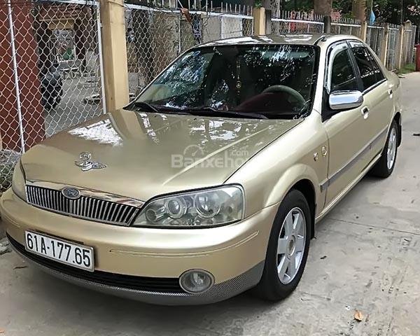 Chính chủ bán Ford Laser GHIA 1.8 MT đời 2002, màu vàng