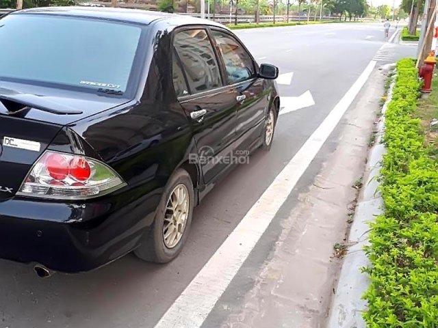 Cần bán gấp Mitsubishi Lancer đời 2004, màu đen số tự động, 218tr