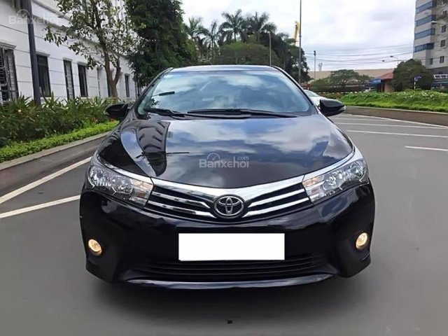 Cần bán gấp Toyota Corolla altis 1.8 sản xuất năm 2015, màu đen như mới