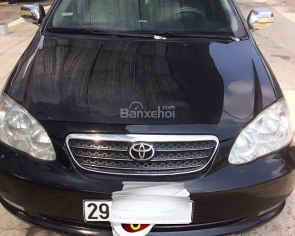 Bán Toyota Corolla altis 1.8G MT 2004, màu đen số sàn, 295tr