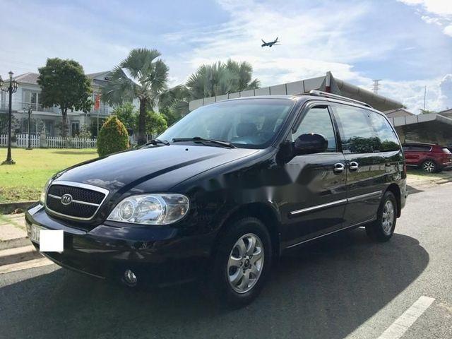 Cần bán lại xe Kia Carnival đời 2009, màu đen, giá chỉ 295 triệu