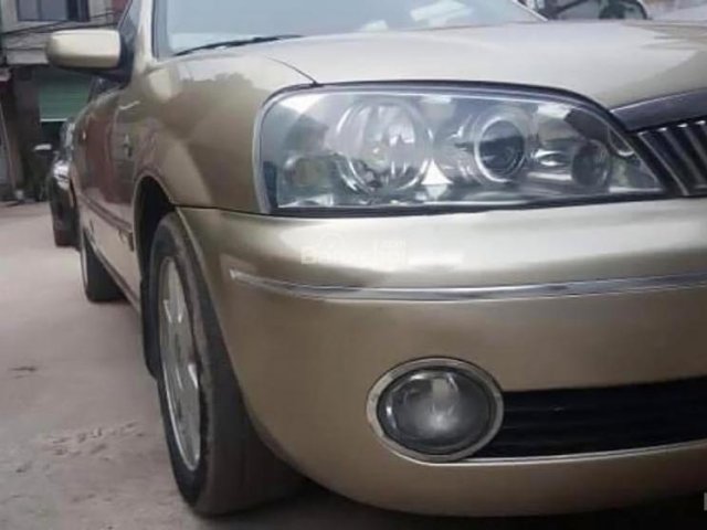 Bán Ford Laser 2002, màu vàng