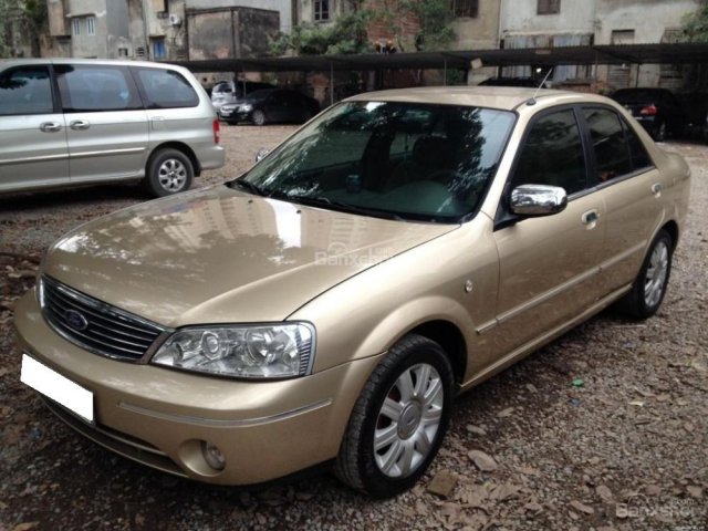 Gia đình cần bán Ford Laser 1.8 SX 2005, số sàn, màu vàng cát còn mới