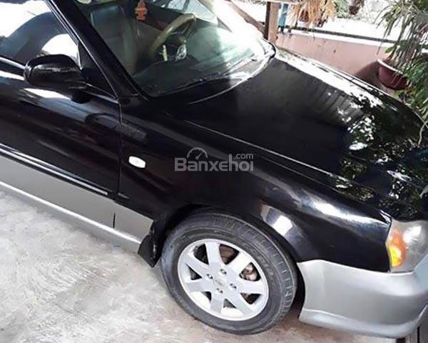 Cần bán Daewoo Magnus 2.5AT đời 2007, màu đen xe gia đình