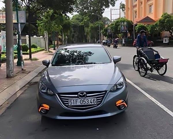 Cần bán xe Mazda 3 1.5 AT đời 2015, màu xám, 572 triệu