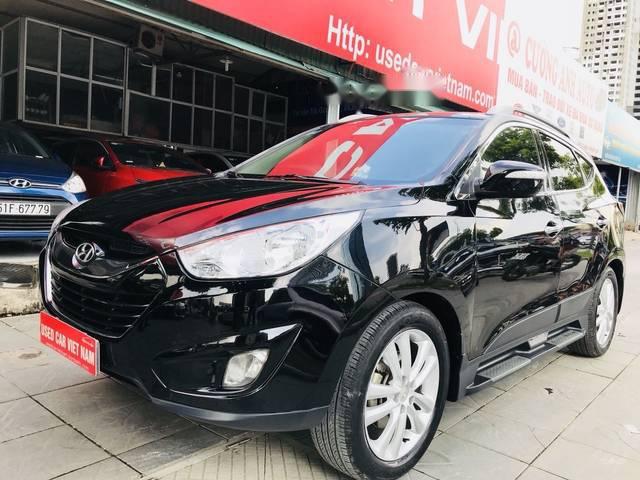 Bán xe Hyundai Tucson 2.0AT 4WD đời 2011, màu đen, 585 triệu