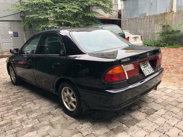 Bán ô tô Mazda 323 đời 1999, màu đen còn mới, giá 88tr