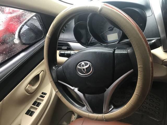 Bán ô tô Toyota Vios E MT đời 2015, màu bạc số sàn