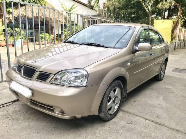 Cần bán xe Daewoo Lacetti 1.6MT năm sản xuất 2004, màu vàng, máy nổ êm ru