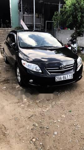 Bán xe Toyota Corolla altis 1.8 AT đời 2009, màu đen xe gia đình, giá tốt0