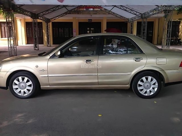 Bán Ford Laser GHIA 1.8 AT 2005, màu vàng cát