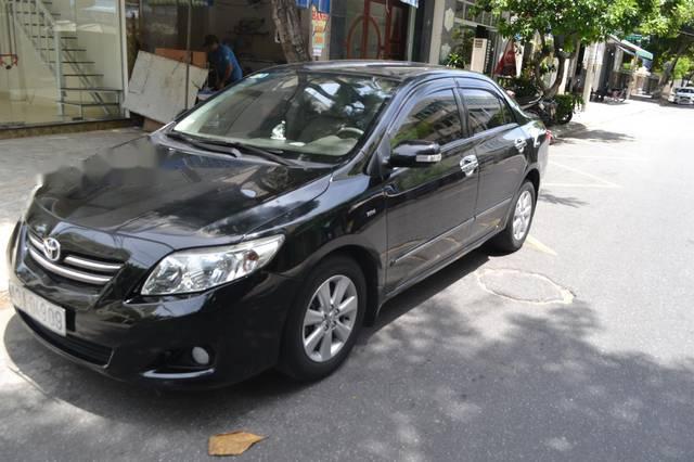 Cần bán Toyota Corolla altis 1.8 AT đời 2009, màu đen như mới 