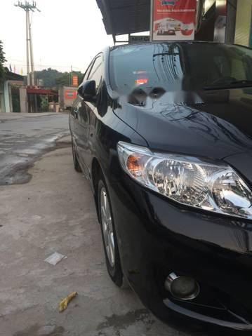 Cần bán Toyota Corolla altis đời 2009, màu đen, số sàn