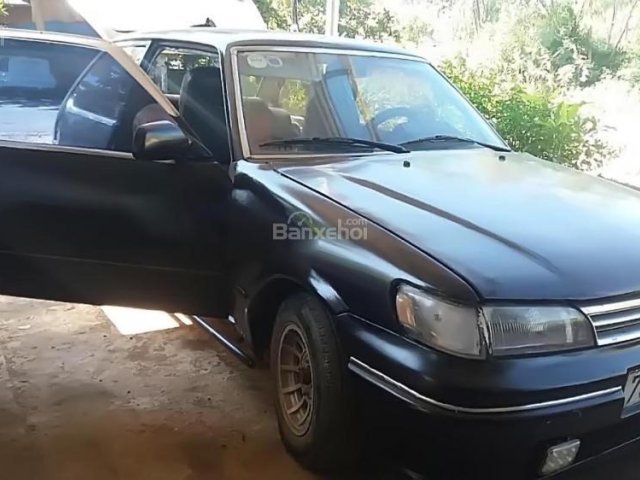 Bán Mazda 323 1990, màu đen, xe đang đi lại bình thường