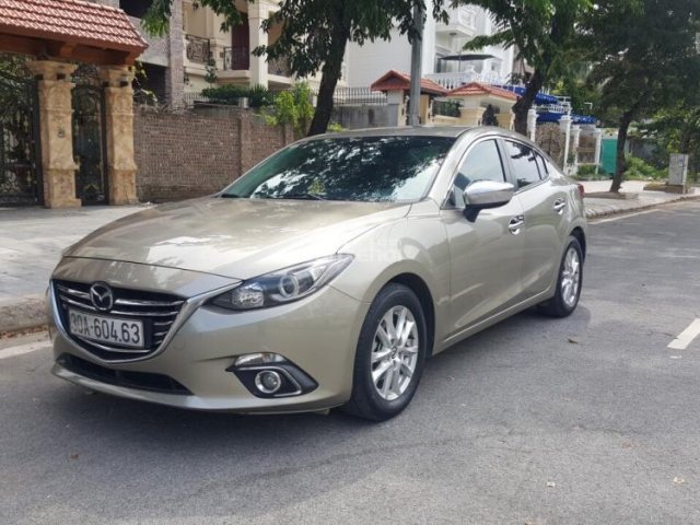 Cần bán xe Mazda 3 1.5AT, màu vàng 2015, giá 595tr