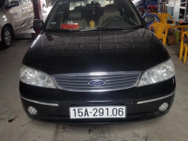 Bán Ford Laser sản xuất 2004, màu đen số tự động, máy zin nguyên bản