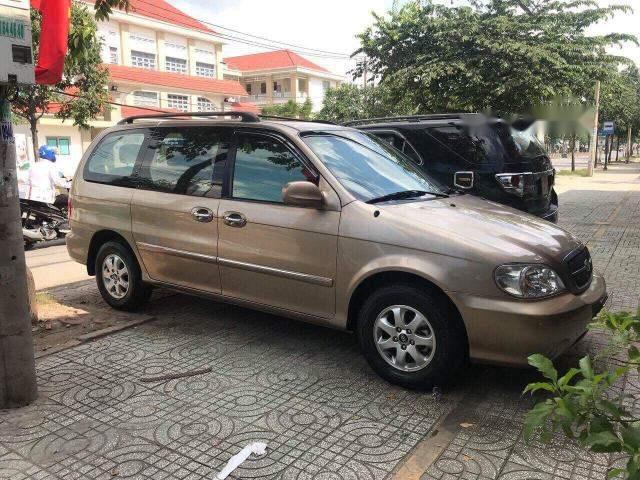 Cần bán Kia Carnival 2009, màu nâu số tự động, 245tr