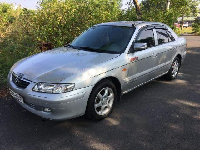 Cần bán gấp Mazda 626 sản xuất năm 2004, màu bạc số sàn